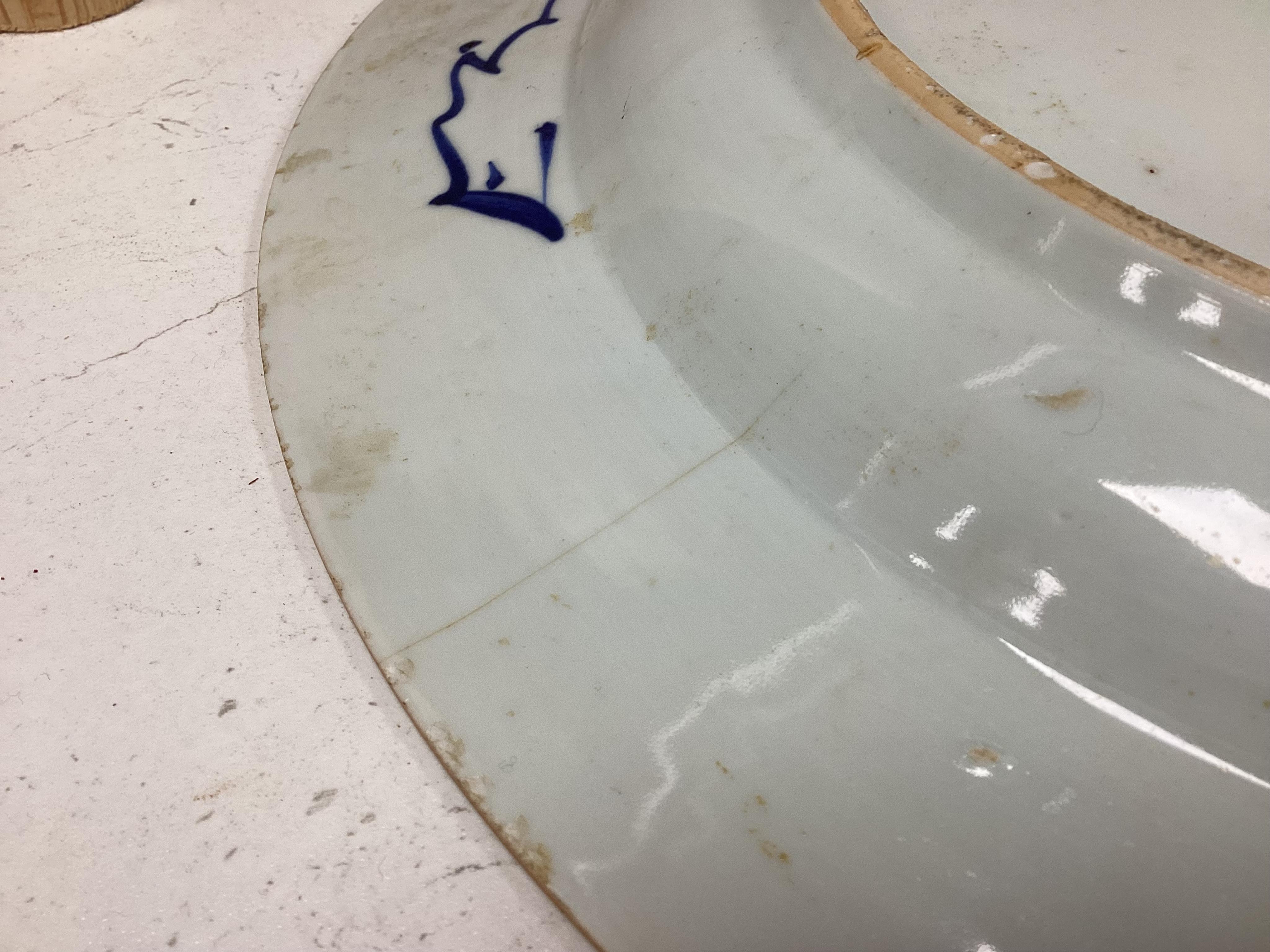 A Worcester teapot, c.1770, an 18th century Chinese famille rose and a blue and white dish, a small blue and white dish, a cup and saucer and teapot, largest dish 39cm (7). Condition - most damaged, cracked or chipped